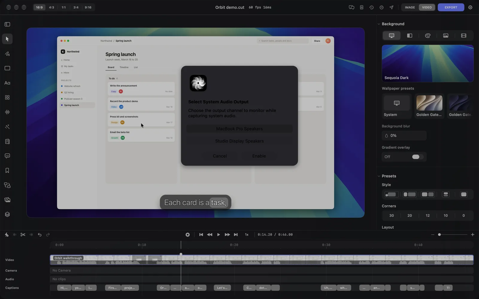 The Select System Audio Output dialog over the editor: Choose the output channel to monitor while capturing system audio, with MacBook Pro Speakers highlighted above Studio Display Speakers, and the Cancel and Enable buttons